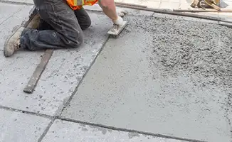 Professional repairing a concrete floor in Tacoma, WA